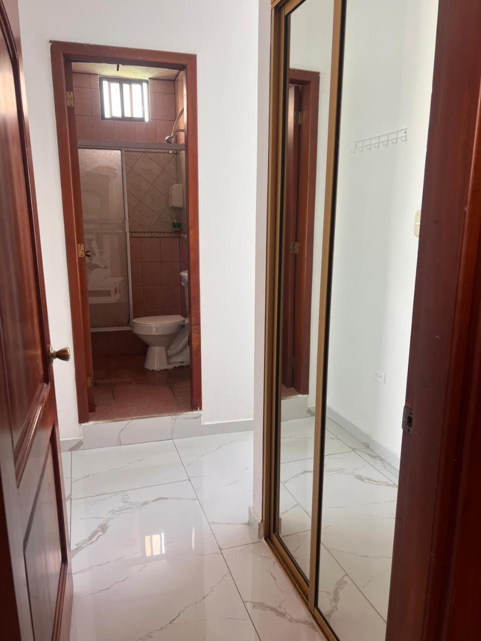 Hostal Carliza ปูแอร์โตอาโยรา ภายนอก รูปภาพ